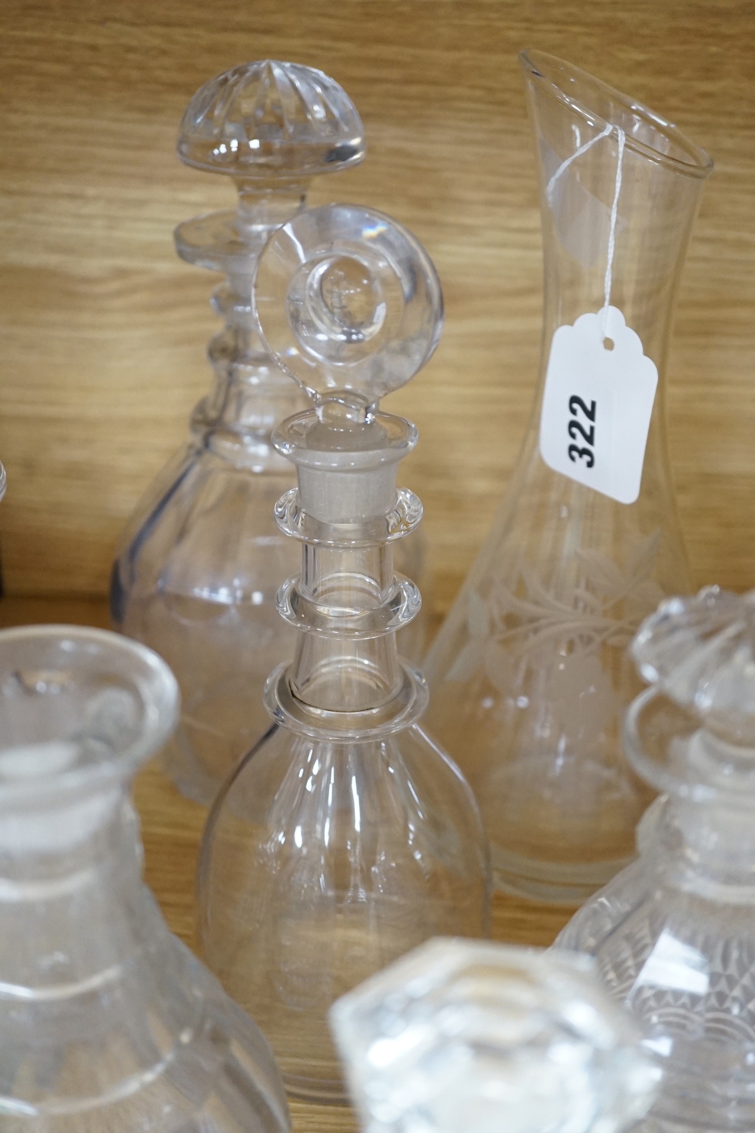 Twelve glass decanters and a carafe (13)